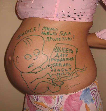 幸福孕妇的创意人体肚皮彩绘图片