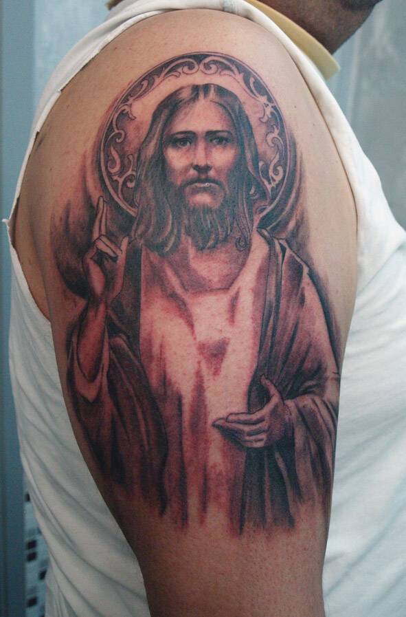 耶稣头像男手臂纹身图案