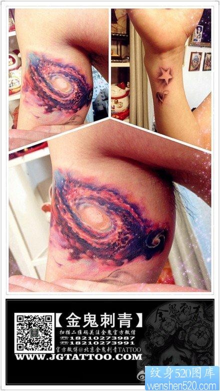 手臂内侧超炫经典的彩色星空纹身图片