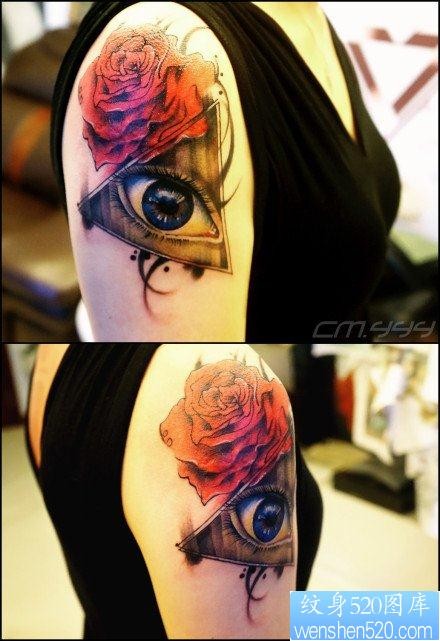 手臂漂亮流行的眼睛与玫瑰花纹身图片