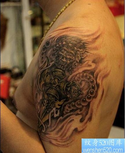 手臂一张宗教降魔杵纹身图片