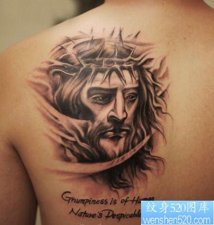 背部一张耶稣肖像纹身图片