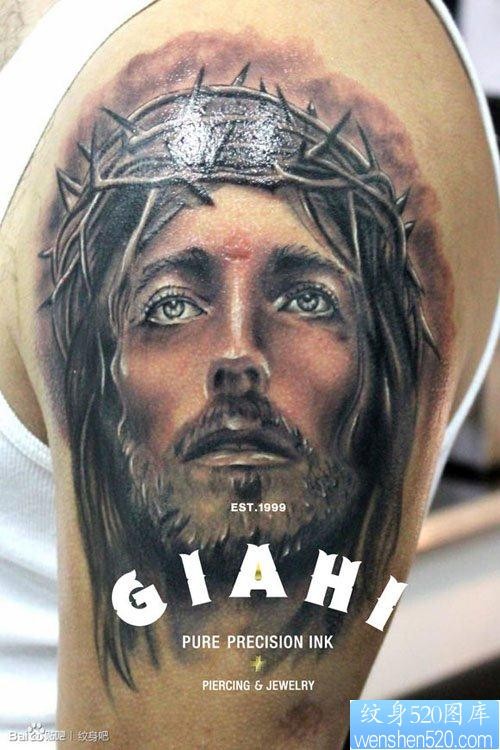 手臂一张前卫经典色耶稣肖像纹身图片