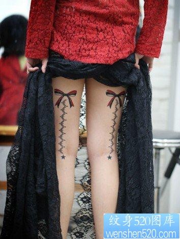美女腿部漂亮的蝴蝶结与蕾丝纹身图片
