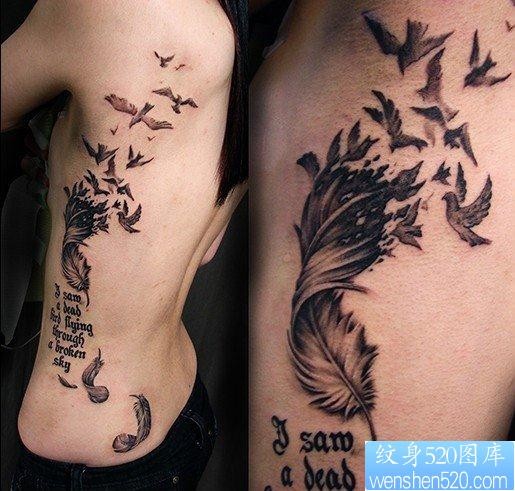 一幅腰部羽化燕字母纹身图片由纹身520图库推荐