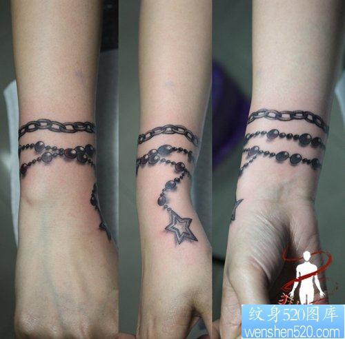 女人手腕处精美的五角星手链纹身图片