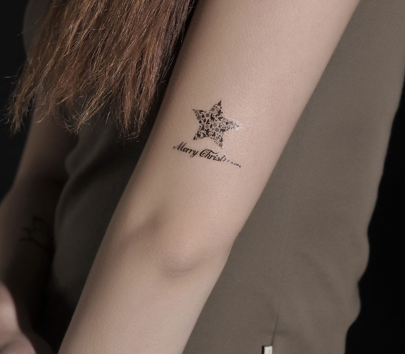 手臂蝴蝶五角星纹身图片由纹身520图库推荐