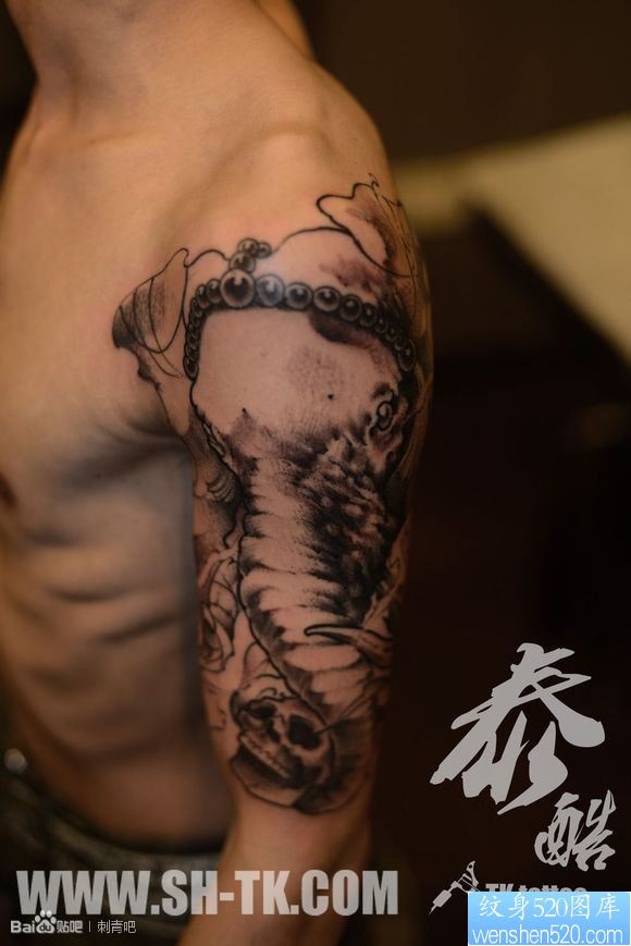男生胳膊象财神骷髅纹身图片