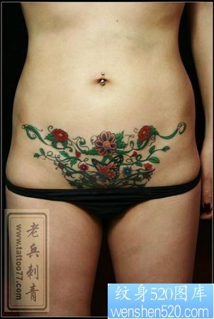 腹部纹身图片：美女腹部彩色蝴蝶花卉藤蔓纹身图片纹身作品