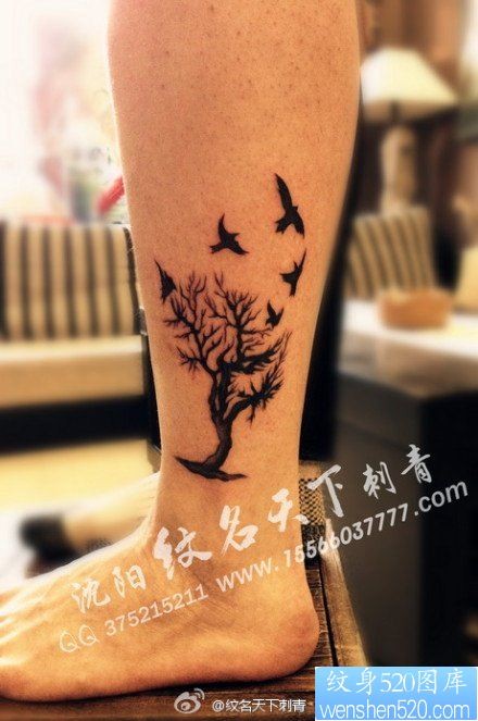 腿部经典潮流的图腾树与小鸟纹身图片