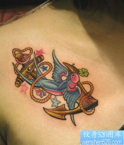 一幅彩色燕子船锚纹身作品