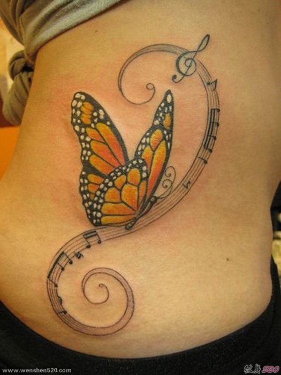 女子侧肋漂亮蝴蝶和五线谱音符纹身图片