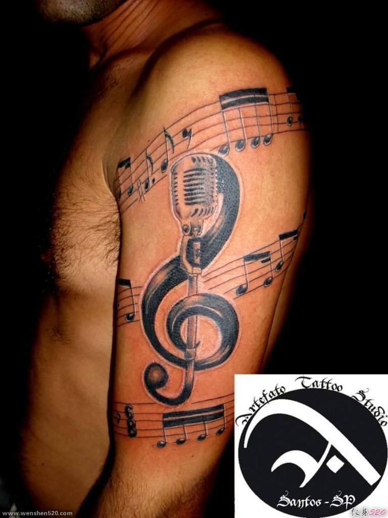 男性手臂帅气的音乐符号主题纹身图案