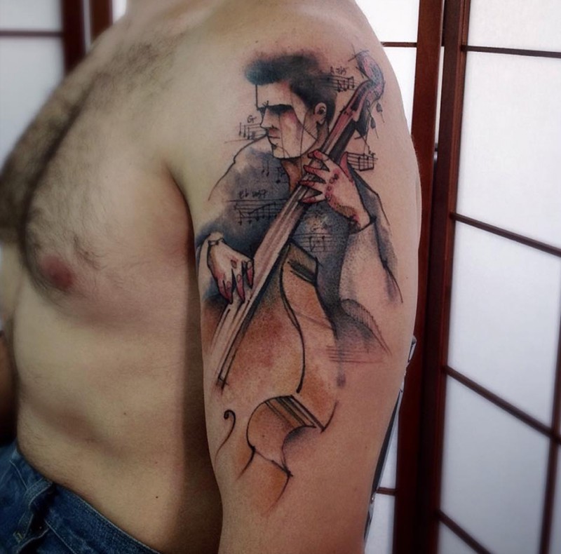 手臂抽象风格的男性音乐家纹身图案