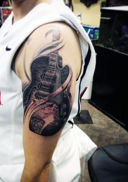 大臂3D写实的黑色吉他纹身图案