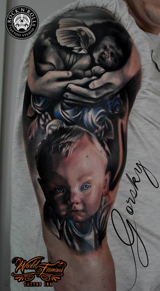 手臂纪念式的彩色小宝宝与天使纹身图案