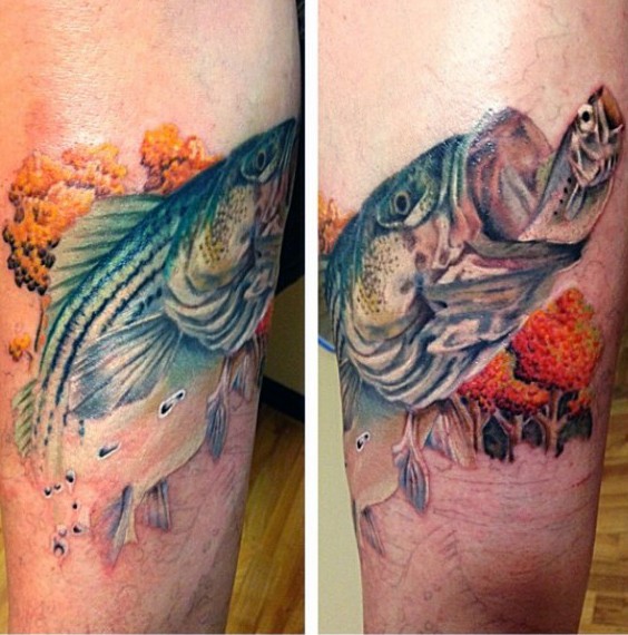 手臂非常写实的彩色大鱼与树林纹身图案
