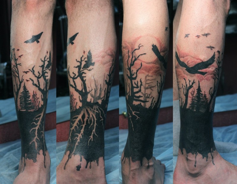 小腿惊人的黑色树和鸟纹身图案