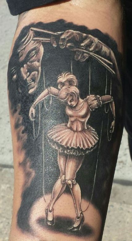 提线木偶女孩彩色手臂纹身图案