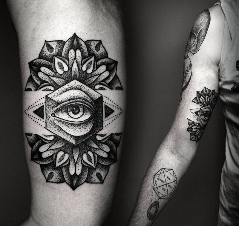 雕刻风格黑色点刺神秘眼睛与梵花手臂纹身图案