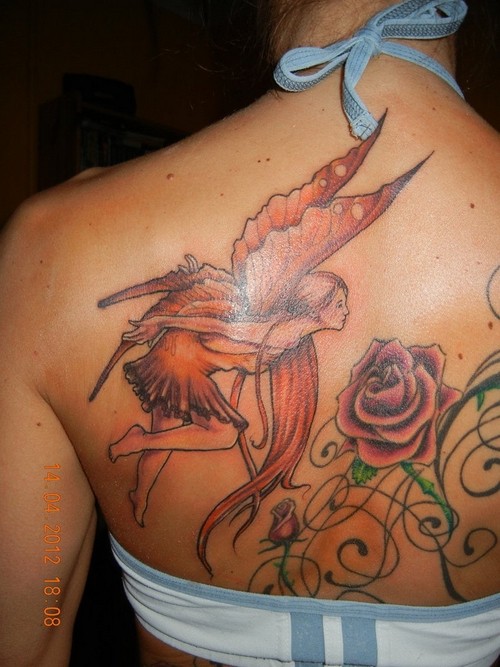 背部童话里的精灵和玫瑰纹身图案