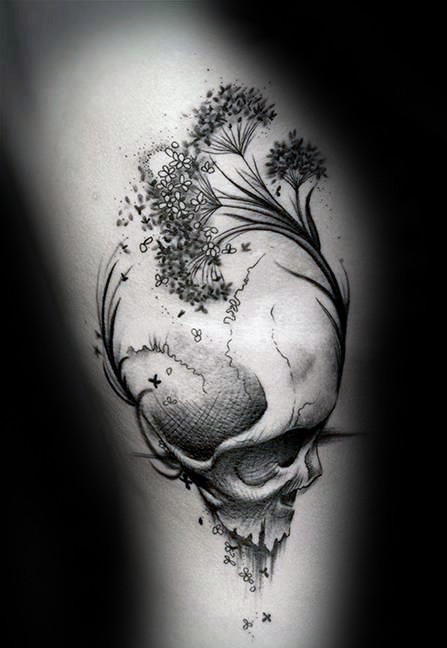 抽象风格的黑白骷髅与植物纹身图案