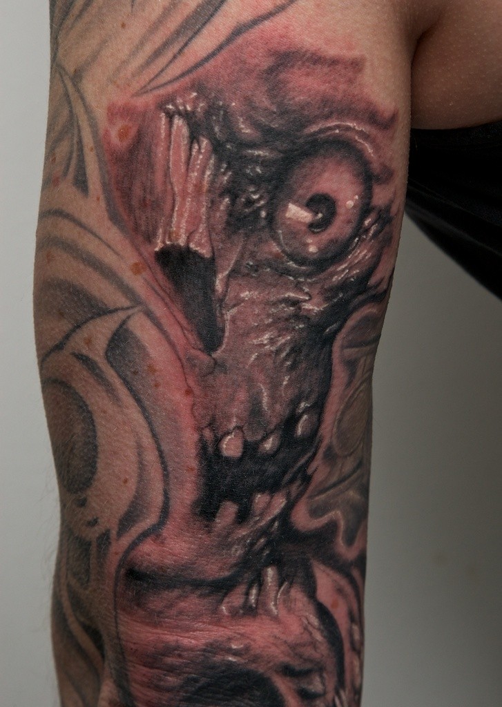 逼真的怪物骷髅黑色手臂纹身图案