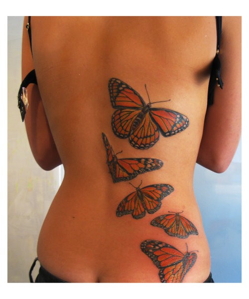背部一群彩色的蝴蝶纹身图案