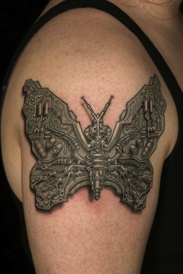 手臂上的个性机械蝴蝶纹身图案