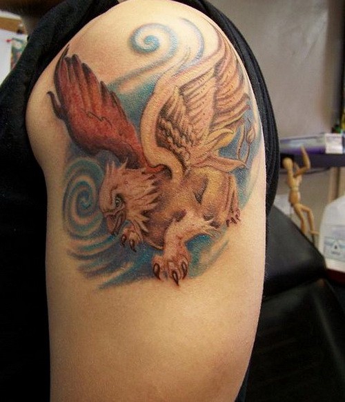 彩色的格里芬神兽和蓝色背景手臂纹身图案