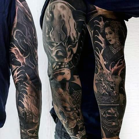 手臂亚洲风格的黑白武士面具和艺伎纹身图案