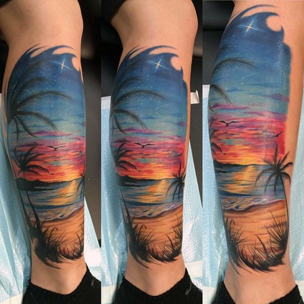 小腿美丽的彩绘海滩与棕榈树纹身图案