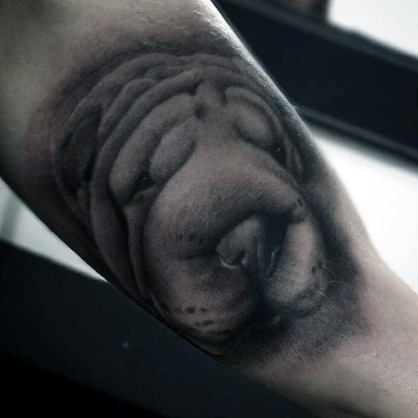 手臂可爱的小狗头像纹身图案