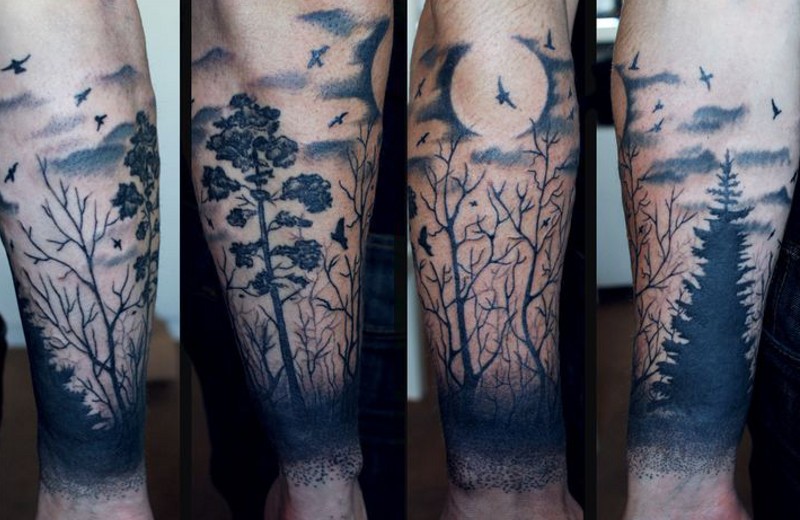 手臂黑色的月亮和森林纹身图案