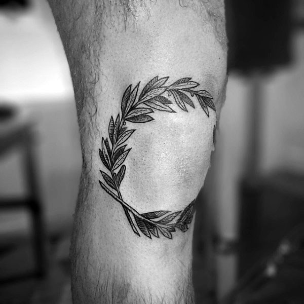 膝盖雕刻风格黑色的叶子纹身图案
