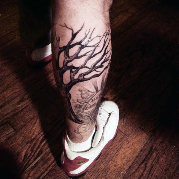 小腿黑色的孤独树与墓地纹身图案