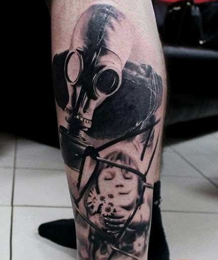 小腿神秘的黑灰防毒面具和男孩纹身图案