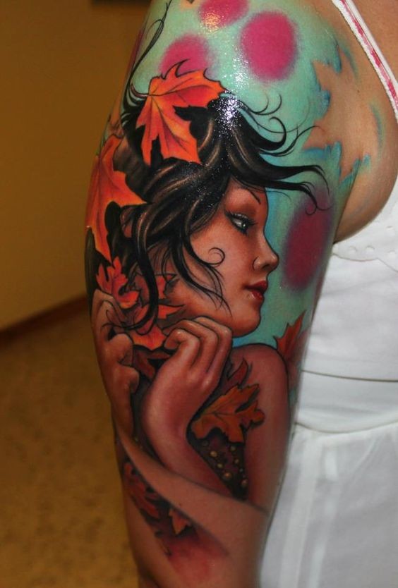 大臂可爱女孩肖像与枫叶纹身图案