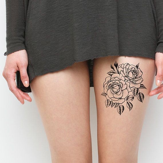 简单的黑色线条花朵大腿纹身图案