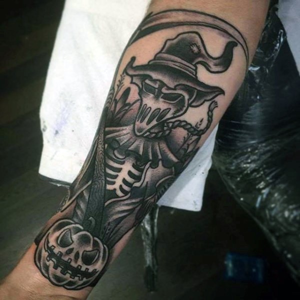 手臂黑色雕刻风格死亡骷髅与南瓜纹身图案