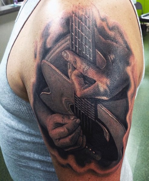 大臂写实的黑灰音乐家与吉他纹身图案
