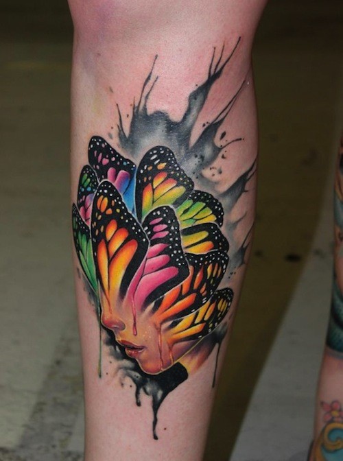 小腿彩色人脸与蝴蝶翅膀结合纹身图案