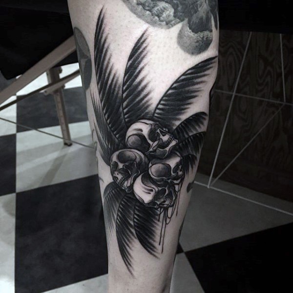 小腿黑色棕榈树与骷髅形状的椰子纹身图案