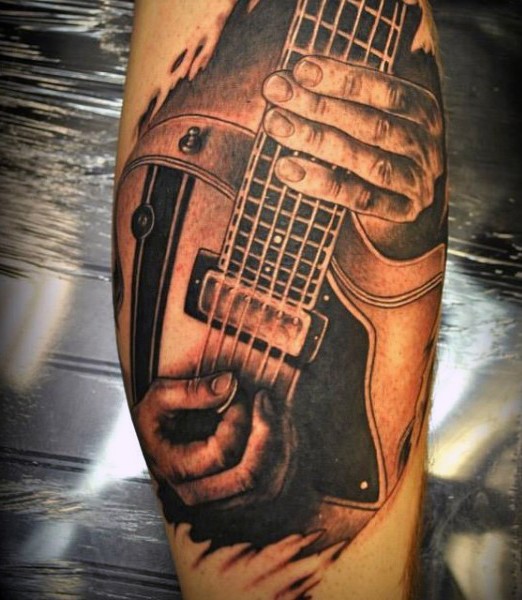 小腿写实音乐家弹吉他纹身图案