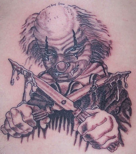 邪恶小丑和刀纹身图案