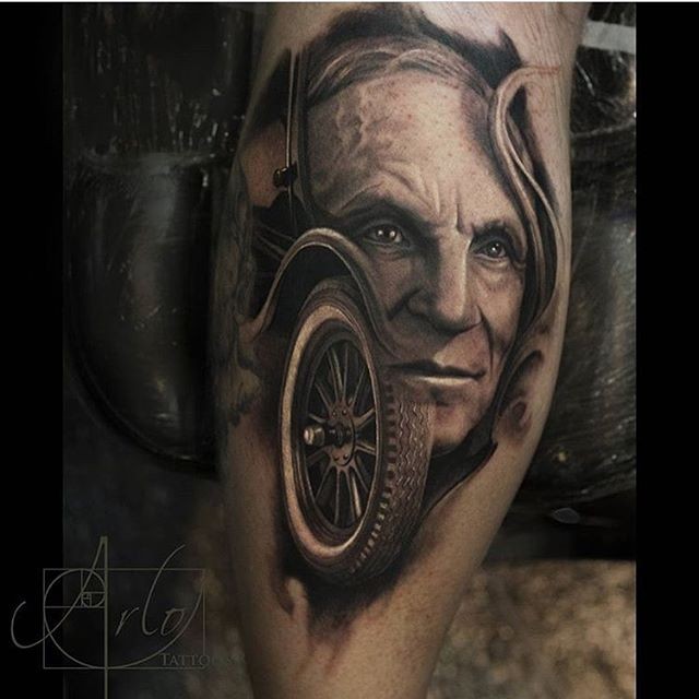 男子肖像和旧汽车车轮纹身图案