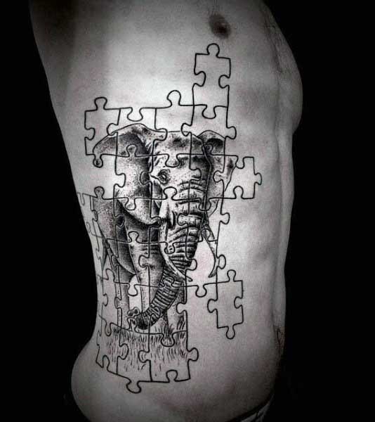 侧肋雕刻风格黑色拼图与大象纹身图案