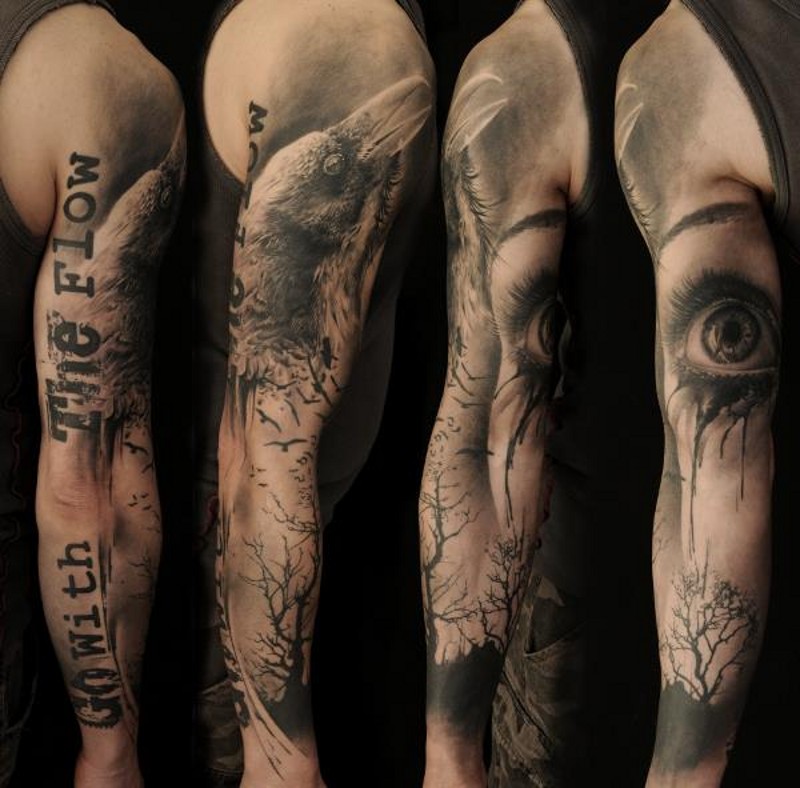 手臂可怕的黑色乌鸦字母和眼睛树纹身图案