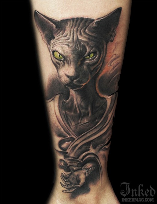 可怕的绿眼睛猫纹身图案