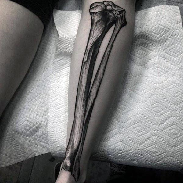 小腿黑色雕刻风格骨头纹身图案
